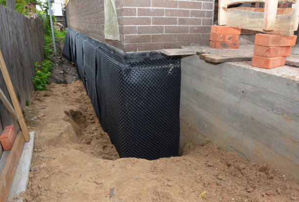 Happy homeowners after waterproofing job in Atlanta